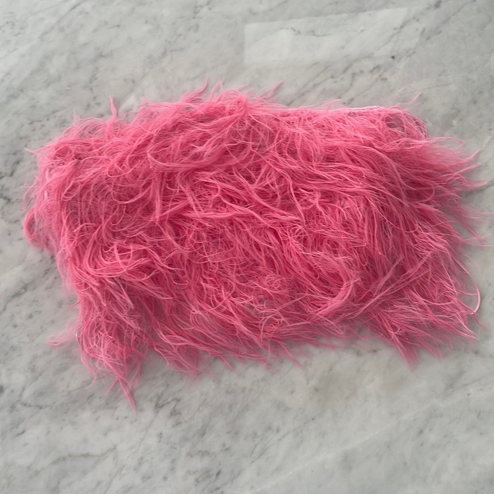 Flirty feathered crop top in a pop pink